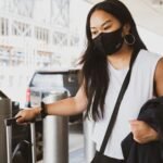 woman in black and white tank top wearing black sunglasses